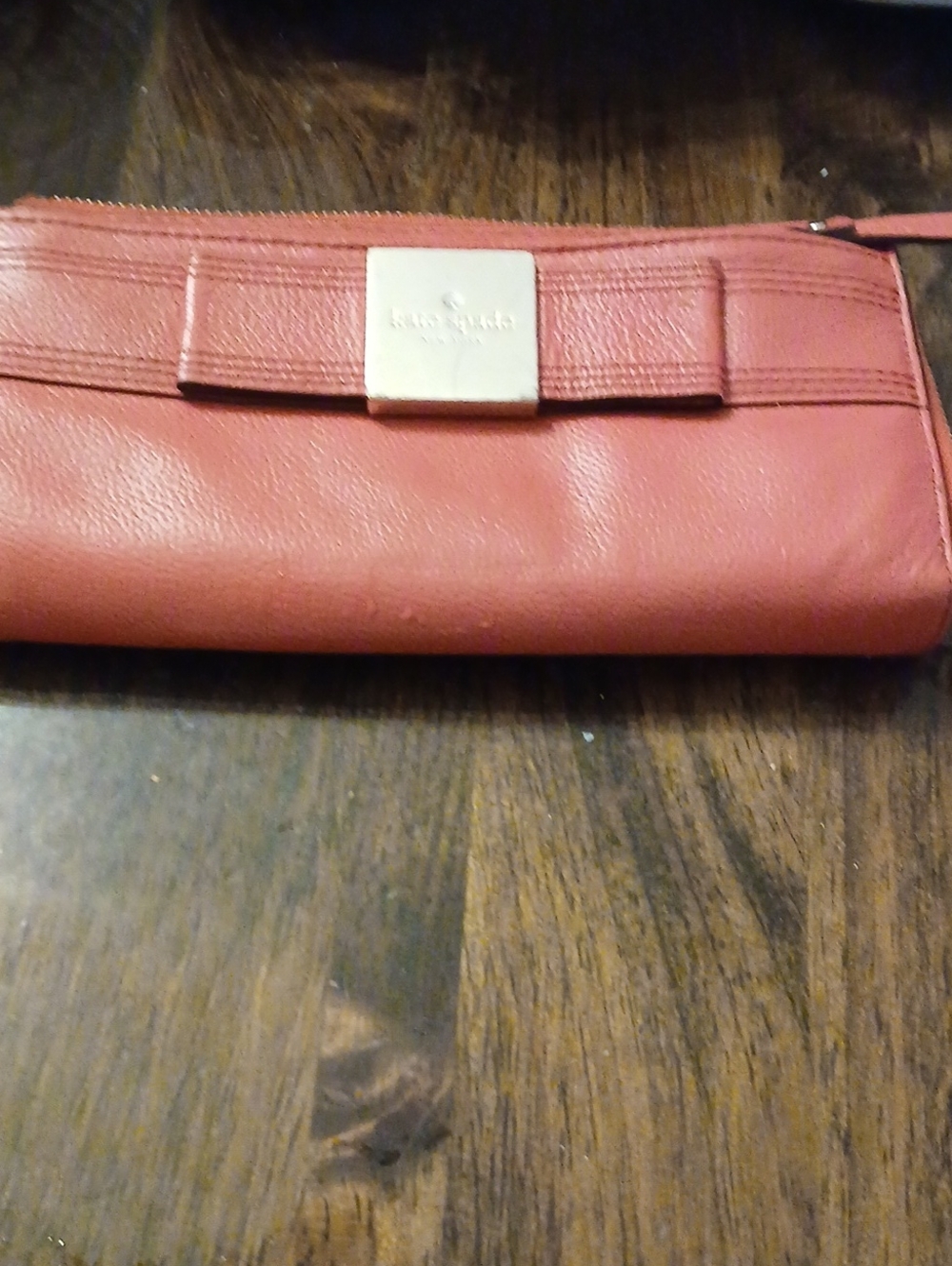 kate spade Coral Leather Bow Wristlet with Gold Plaque